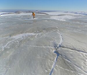 The refrozen Jökulhlaup water, dispersed across the ice, is very prominent because of its striking olive-green colour