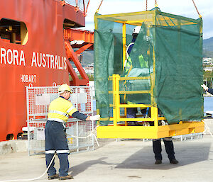 The expeditioner is lowered to the wharf