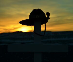 Sunrise behind army slouch hat