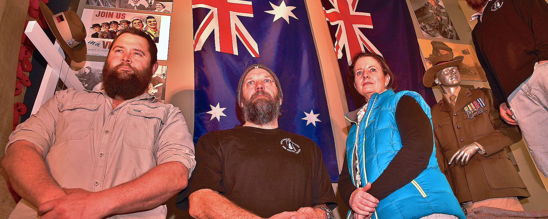 Davis station expeditioners in front of an ANZAC display on station. Current and ex defence personnel at Davis, from left to right Marc Mills (ex Army), Dennis Bormann (ex Army), Jan Wallace (current Army) and William Seal (ex RAAF).