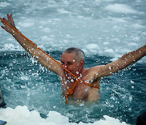 Expeditioner taking an icy dip