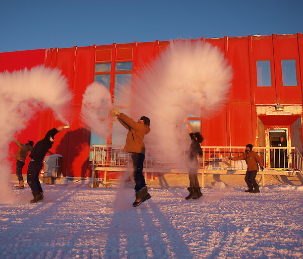 Throwing boiling water into the air to create instant snow