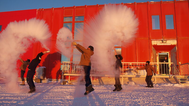 Throwing boiling water into the air to create instant snow