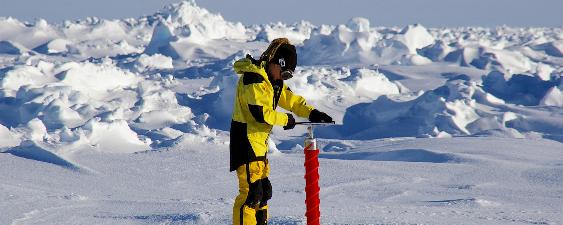Scientist drilling ice core in Antarctica