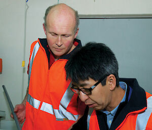 Dr So Kawaguchi (right) and colleague Mr Rob King operate the krill aquarium at the Australian Antarctic Division. The facility is the only one of its kind in the world.