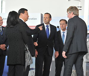 The official party discuss the live weather on display from Dome A in Antarctica