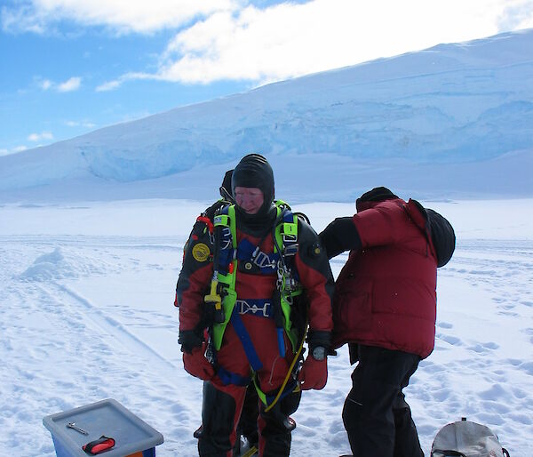 Divers prepare to enter the chilly Antarctic waters