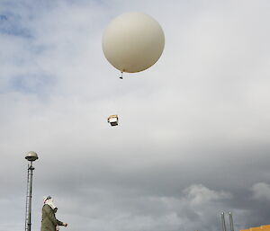 A scientist releases an ozone balloon at Davis