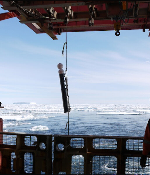 A camera system designed to be attached to longline gear is deployed off the back of a ship.