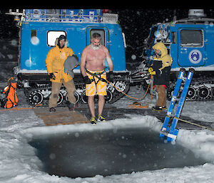 Paul Stringer roped up and ready to jump in the ice hole