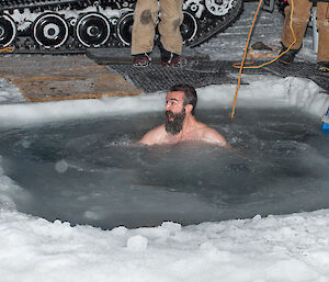 Electrician, Adam Gurney, in the ice hole.