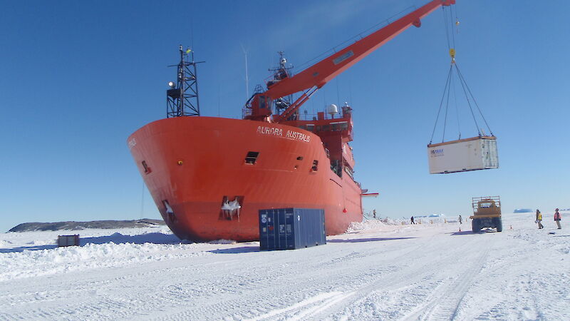 The Aurora Australis unloads cargo on the fast ice at Davis station.