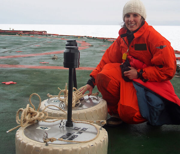 Dr Alison Kohout with two of her wave sensors on the stern of the Aurora Australis during the Sea Ice Physics and Ecosystem eXperiment (SIPEX-II) voyage in September 2012.