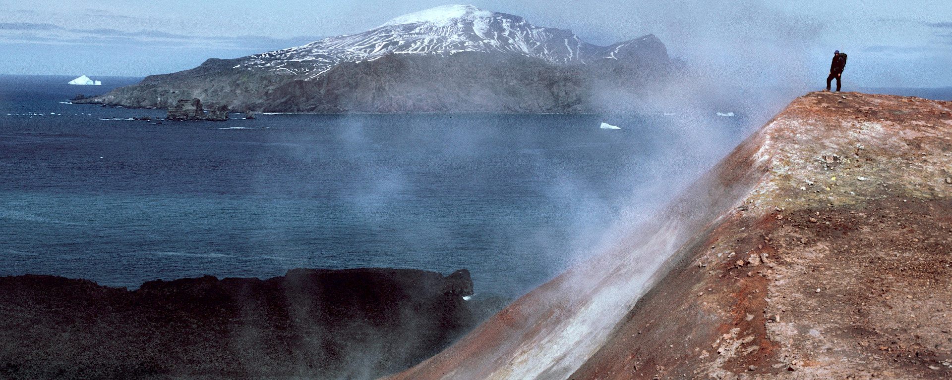 A man stands in a cloud of volcanic steam in the Antarctic South Sandwich Islands