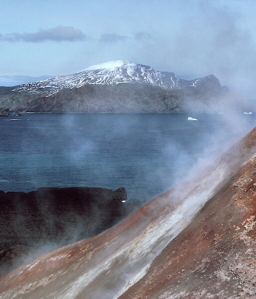 A man stands in a cloud of volcanic steam in the Antarctic South Sandwich Islands