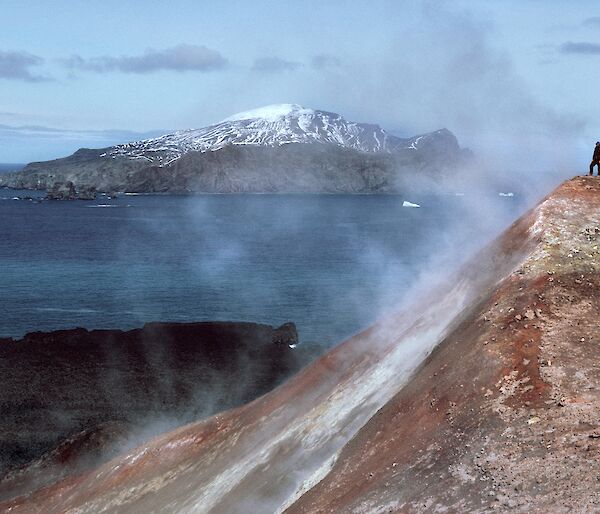 A man stands in a cloud of volcanic steam in the Antarctic South Sandwich Islands