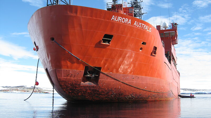 The bow of the Aurora Australis with lines running from the ship