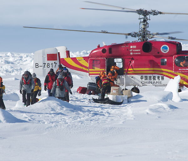 Passengers disembarking from helicopter