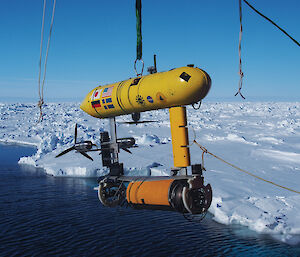 The Autonomous Underwater Vehicle (AUV) being lowered off the stern of the ship. The data from the AUV is used to make 3-D maps of the underside of the sea ice.