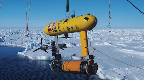 The Autonomous Underwater Vehicle (AUV) being lowered off the stern of the ship. The data from the AUV is used to make 3-D maps of the underside of the sea ice.
