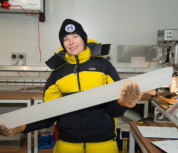 Dr Tessa Vance with an ice core from Aurora Basin in the new ice core facility at IMAS.