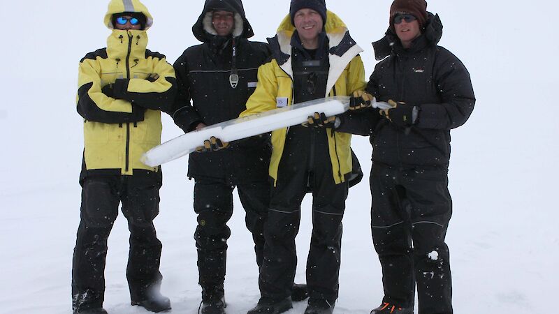 Scientists holding ice core