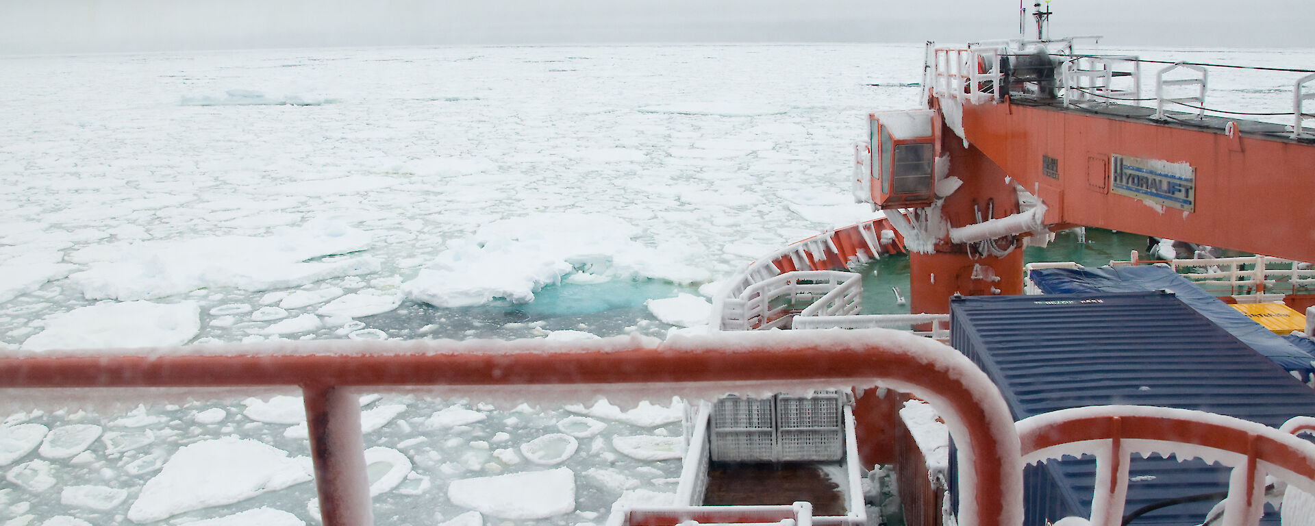 A frozen Aurora Australis in pancake ice, Southern Ocean