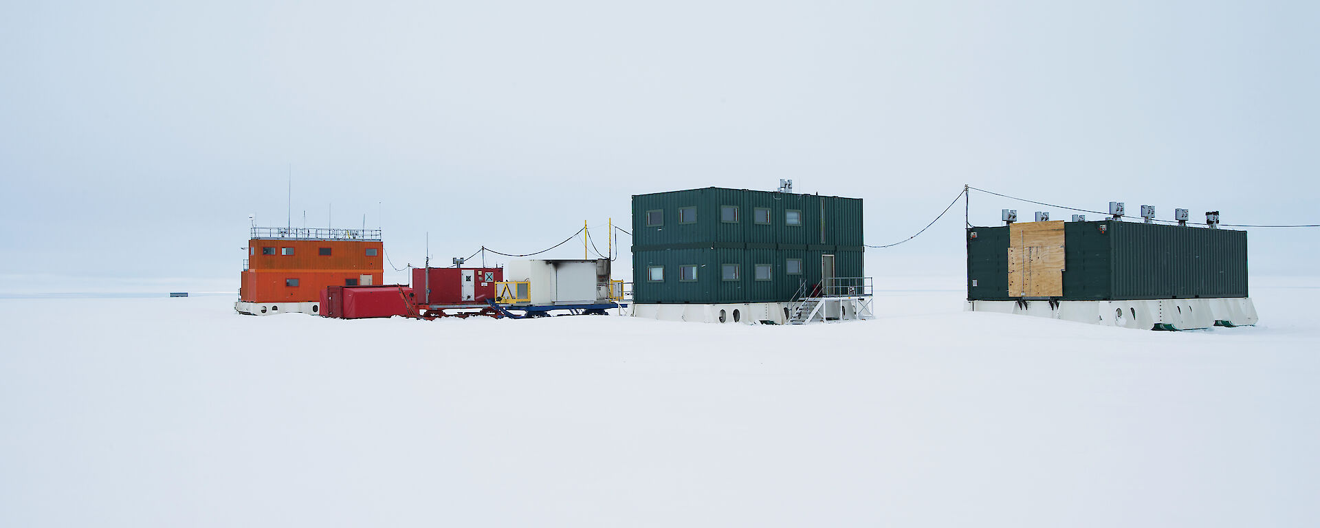 Hawke’s Hut is the double-storey green building in the centre