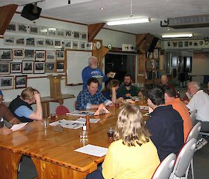 Station leader conducts station meeting at Macquarie Island