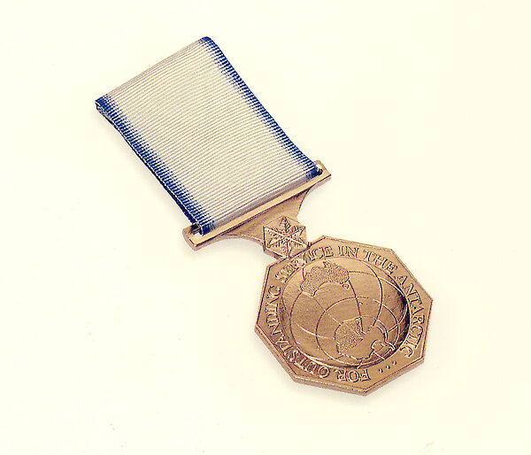 This bronze medal shows a map of Antarctica and the words ‘For outstanding service in the Antarctic'