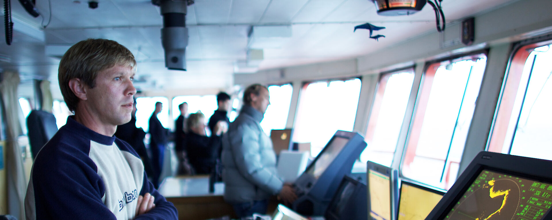 Scott on the bridge with a radar screen in front