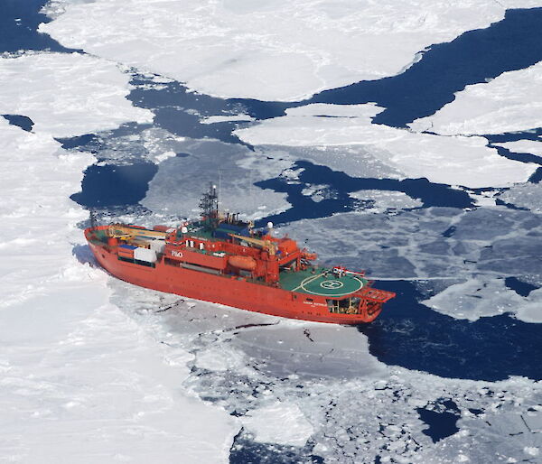 Sea ice surrounds Aurora Australis off the coast of Antarctica