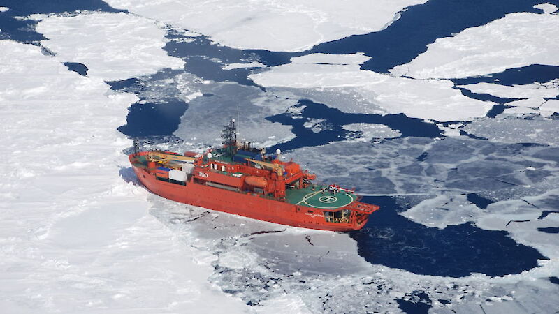 Sea ice surrounds Aurora Australis off the coast of Antarctica