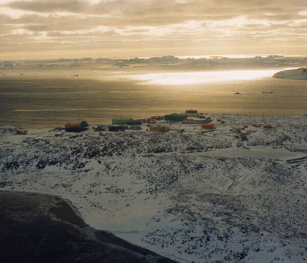 Mirror-like sea off Davis coast, station buildings in background