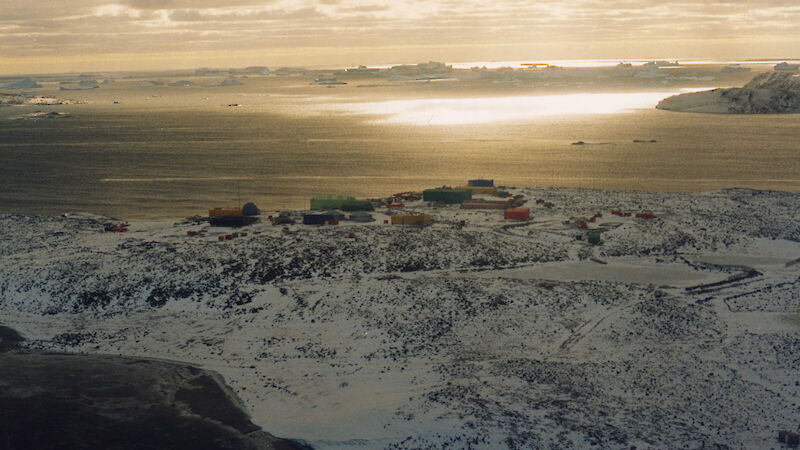 Mirror-like sea off Davis coast, station buildings in background