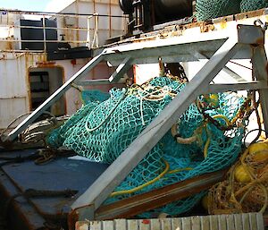 A steel sled or beam trawl used to collect sea floor samples, on the deck of a ship.