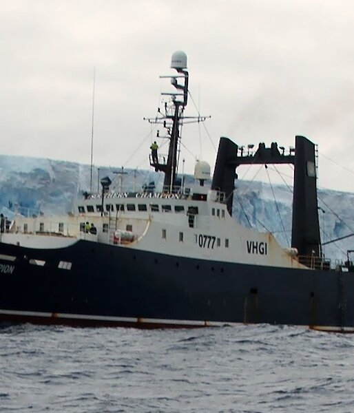The Patagonian toothfish vessel, Southern Champion, alongside an iceberg in Antarctica.