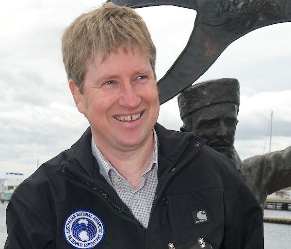 Tony Fleming holding the time capsule