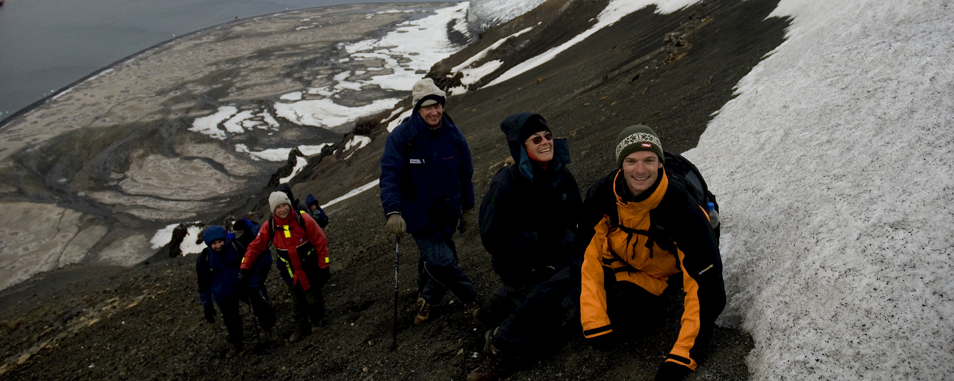 Tourists climb the slopes of Franklin Island, a little visited island in the Ross Sea