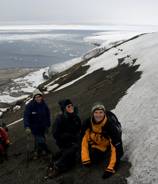 Tourists climb the slopes of Franklin Island, a little visited island in the Ross Sea