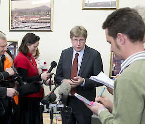 Australian Antarctic Division Director Tony Fleming gives a press conference at the Hobart airport