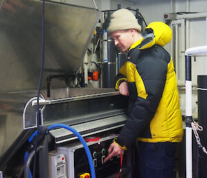 Australian Antarctic Division krill aquarium manager Rob King, using a fish pump to catch krill in the Antarctic sea ice zone.