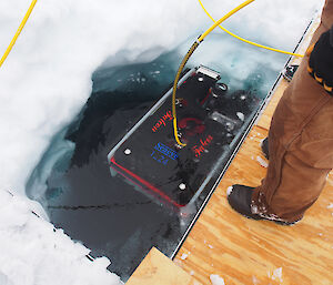 The Remotely Operated Vehicle (ROV) being readied for deployment under the Antarctic sea ice.