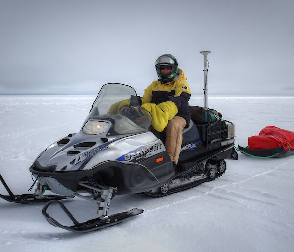 University of Tasmania scientist Dr Reed Burgette on a skidoo equipped with Global Positioning System equipment to obtain high resolution in situ estimates of surface topography, required to validate airborne and satellite data.