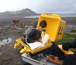 The camera and its water-proof casing.