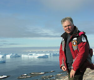 Dr Nico with icebergs in Antarctica