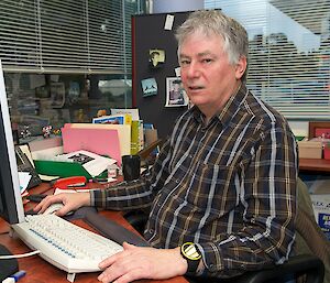 Dr Nicol at his computer in his Antarctic Division office