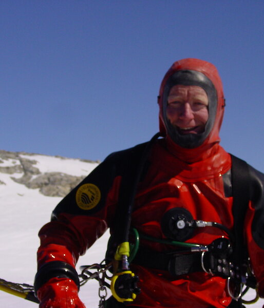 Dr Riddle in a drysuit preparing to dive as part of research into human impacts in Antarctica
