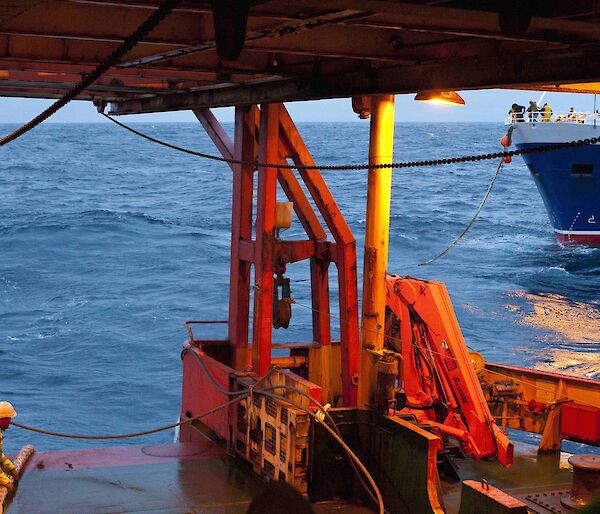 Aurora Australis crew member attaching the tow rope to the F.V. Janas