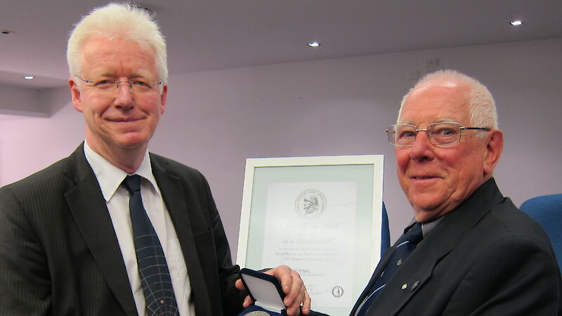 Dr Martin Riddle receives the inaugural Phillip Law Medal from the ANARE club’s Ray McMahon